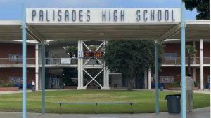 Flames engulfing parts of Palisades Charter High School during LA wildfire