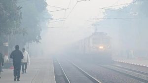 A dense smog covering Delhi streets, disrupting traffic and air travel.